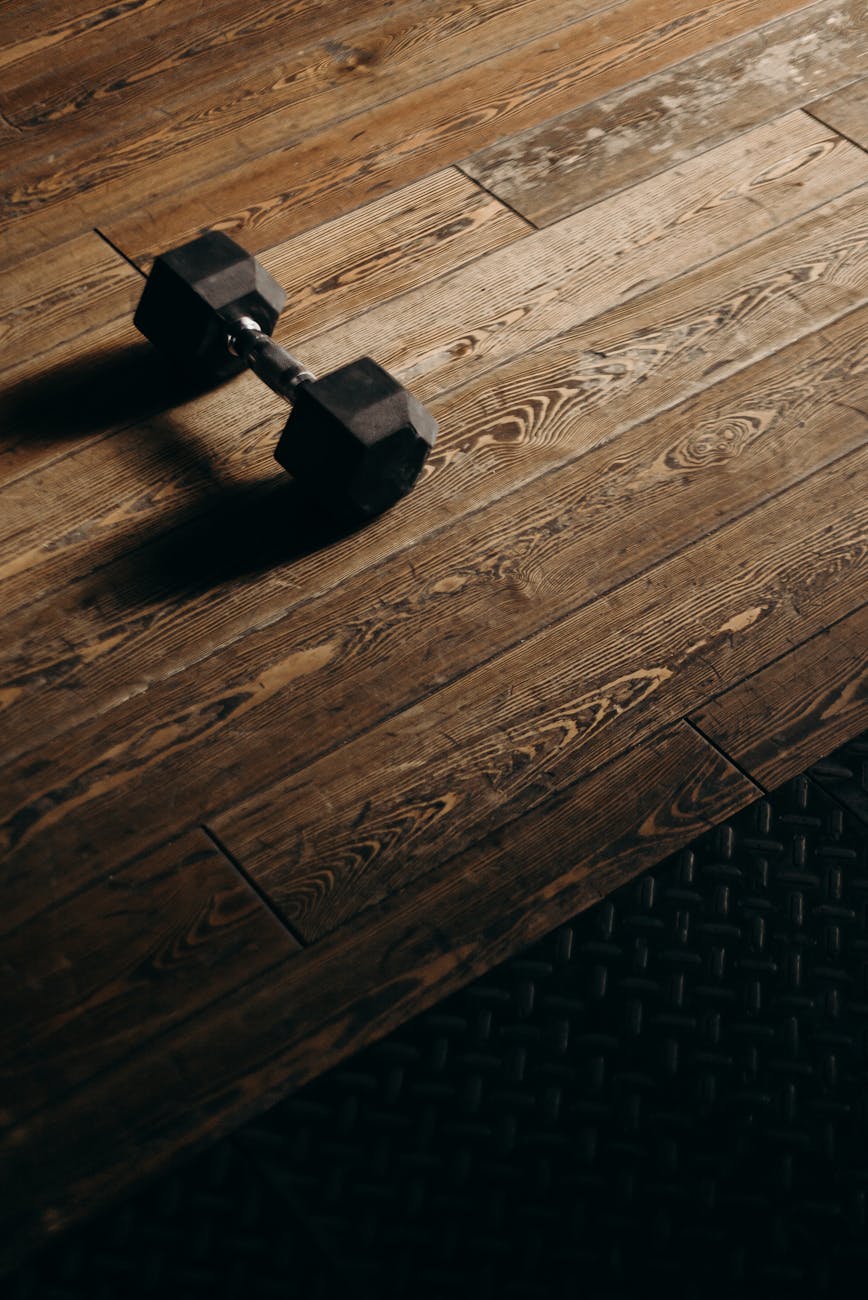 Close-up of exercise equipment on a wooden floor.